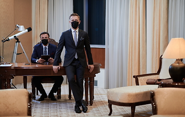 Image showing business team wearing crona virus protection face mask