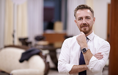 Image showing Portrait of smiling ceo at modern office in stylish suit