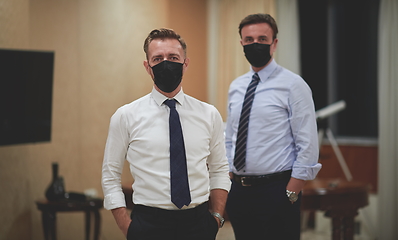 Image showing business team wearing crona virus protection face mask