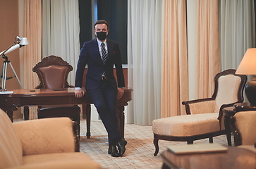 Image showing business man wearing protective face mask at office