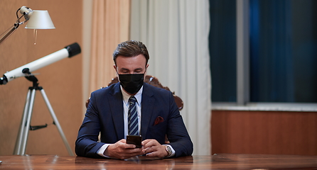 Image showing business man wearing protective face mask at office