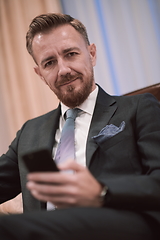 Image showing Portrait of smiling ceo at modern office in stylish suit