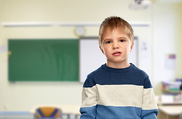 Image showing little boy in striped pullover at school