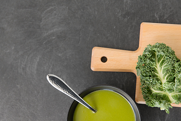 Image showing kale cabbage cream soup in bowl with spoon