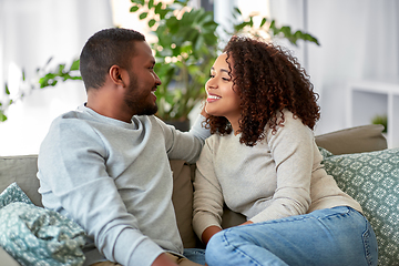 Image showing african american couple on sofa talking at home