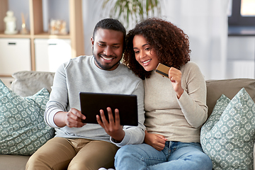 Image showing couple with tablet pc and credit card at home