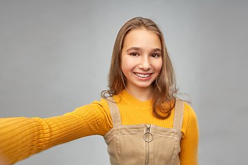 Image showing happy teenage girl taking selfie