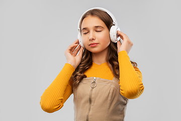 Image showing teenage girl in headphones listening to music