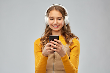 Image showing teenage girl in headphones listening to music