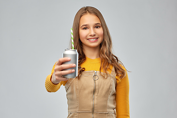 Image showing happy teenage girl drinking soda from can