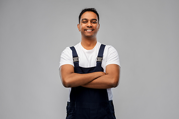 Image showing happy indian worker or builder with crossed arms