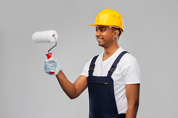 Image showing happy indian painter or builder with paint roller