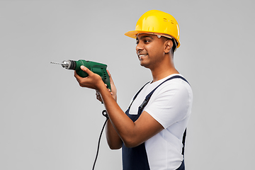 Image showing happy indian builder in helmet with electric drill