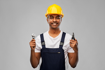 Image showing indian builder in helmet with wrench and pliers