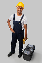 Image showing happy indian builder in helmet with tool box