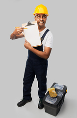 Image showing builder in helmet with clipboard and tool box