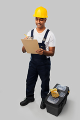 Image showing builder in helmet with clipboard and tool box