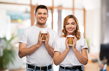 Image showing portrait of happy couple with takeaway coffee cups