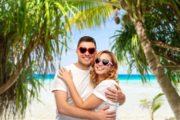 Image showing happy couple in white t-shirts and sunglasses