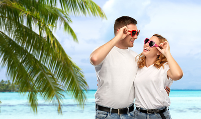 Image showing happy couple in white t-shirts and sunglasses