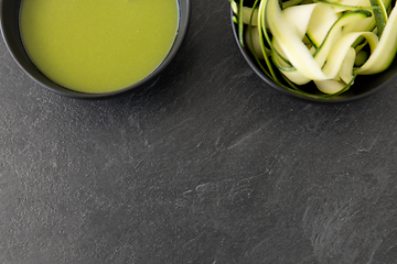 Image showing peeled or sliced zucchini and cream soup in bowl