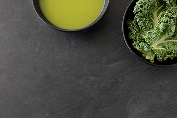 Image showing kale cabbage cream soup in bowl with spoon