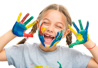 Image showing Portrait of a cute girl playing with paints