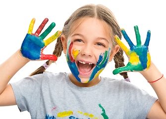 Image showing Portrait of a cute girl playing with paints