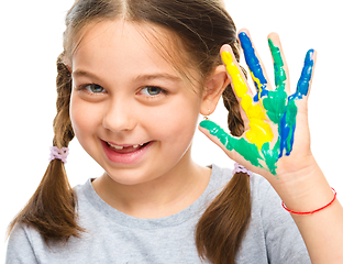 Image showing Portrait of a cute girl playing with paints