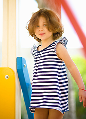 Image showing Cute little girl is playing in playground