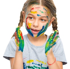 Image showing Portrait of a cute girl playing with paints