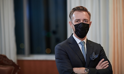 Image showing business man wearing protective face mask at office