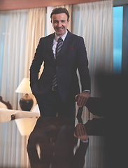 Image showing Portrait of smiling ceo at modern office in stylish suit