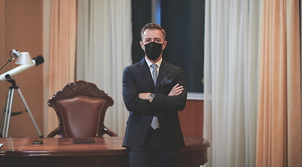 Image showing business man wearing protective face mask at office