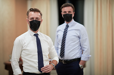 Image showing business team wearing crona virus protection face mask