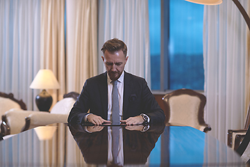 Image showing business man using tablet computer