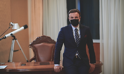 Image showing business man wearing protective face mask at office