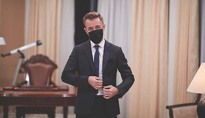 Image showing business man wearing protective face mask at office