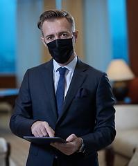 Image showing business man wearing protective face mask at office