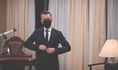 Image showing business man wearing protective face mask at office