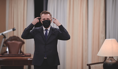 Image showing business man wearing protective face mask at office