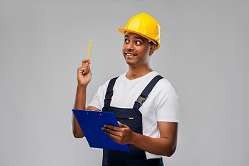 Image showing builder with clipboard and pencil having idea