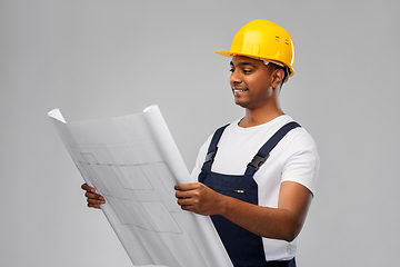 Image showing happy indian builder in helmet with blueprint