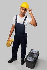 Image showing happy indian builder in helmet with tool box
