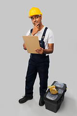 Image showing builder with clipboard and tool box thinking