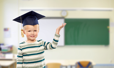 Image showing little boy in mortar board at school