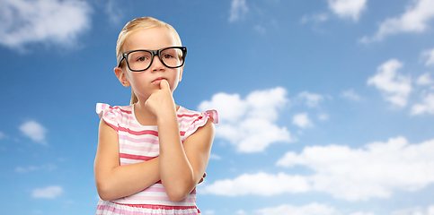 Image showing cute little girl in black glasses thinking