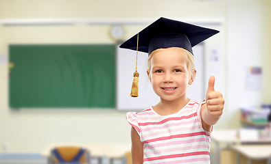 Image showing girl in mortarboard showing thumbs up at school