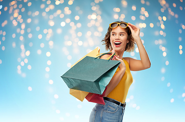 Image showing happy smiling young woman with shopping bags