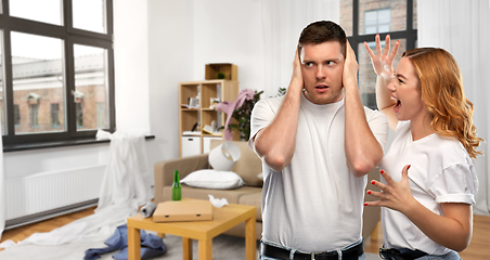 Image showing couple having argument over messy home room